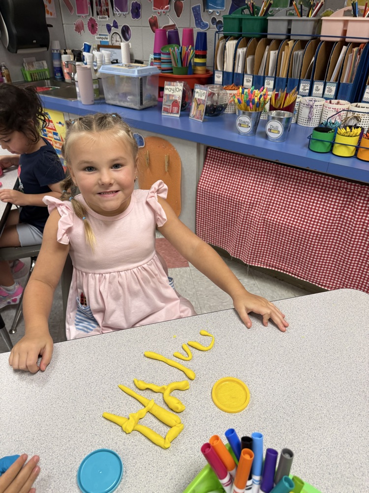 students making names with playdough 