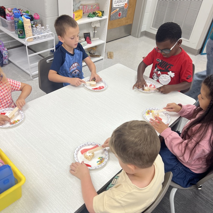 this image shows children and Miss Thompson’s class creating friendship sushi.