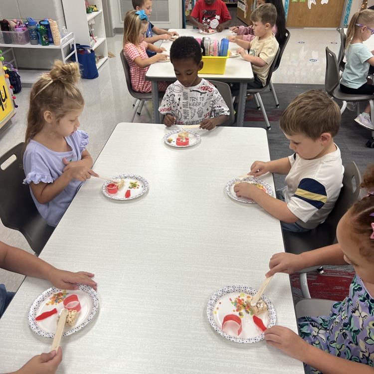 this image shows children and Miss Thompson’s class creating friendship sushi.
