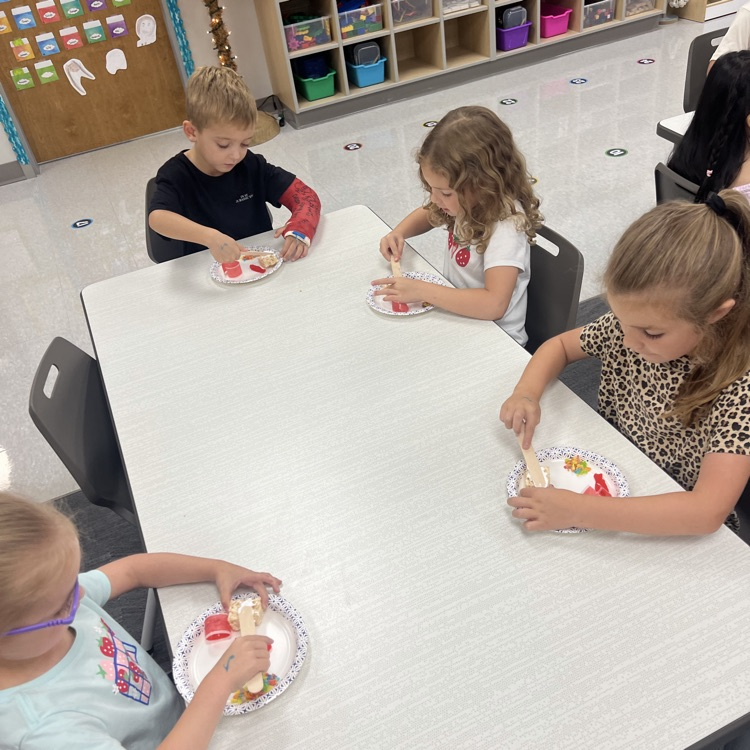 this image shows children and Miss Thompson’s class creating friendship sushi.