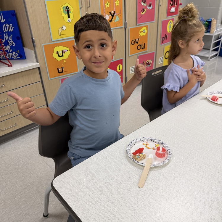 this image shows children and Miss Thompson’s class creating friendship sushi.