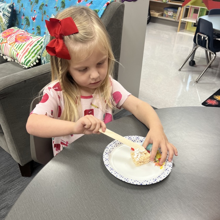 this image shows children and Miss Thompson’s class creating friendship sushi.