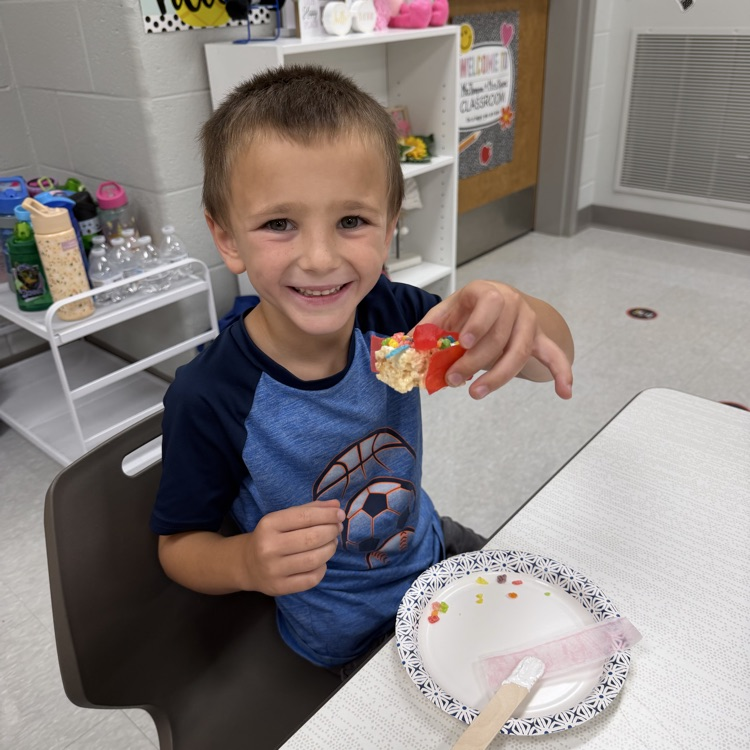 this image shows children and Miss Thompson’s class creating friendship sushi.
