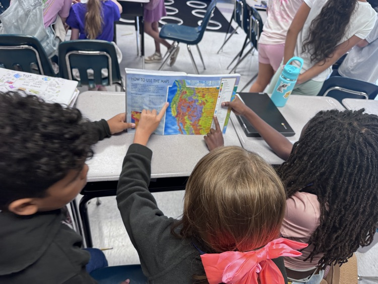 students reading maps