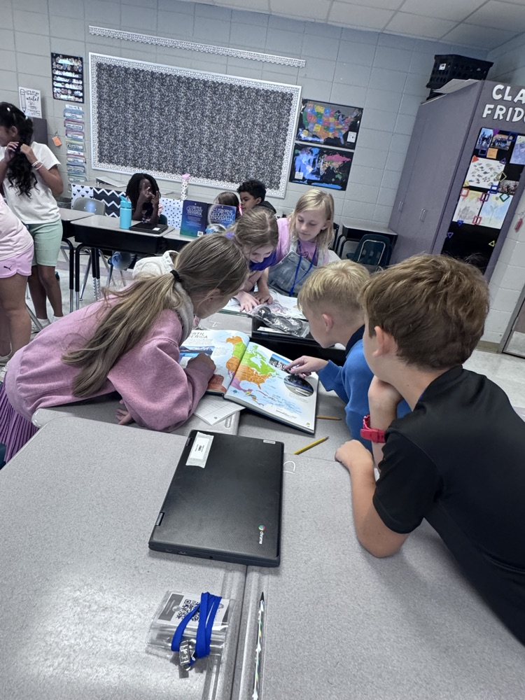 students reading maps