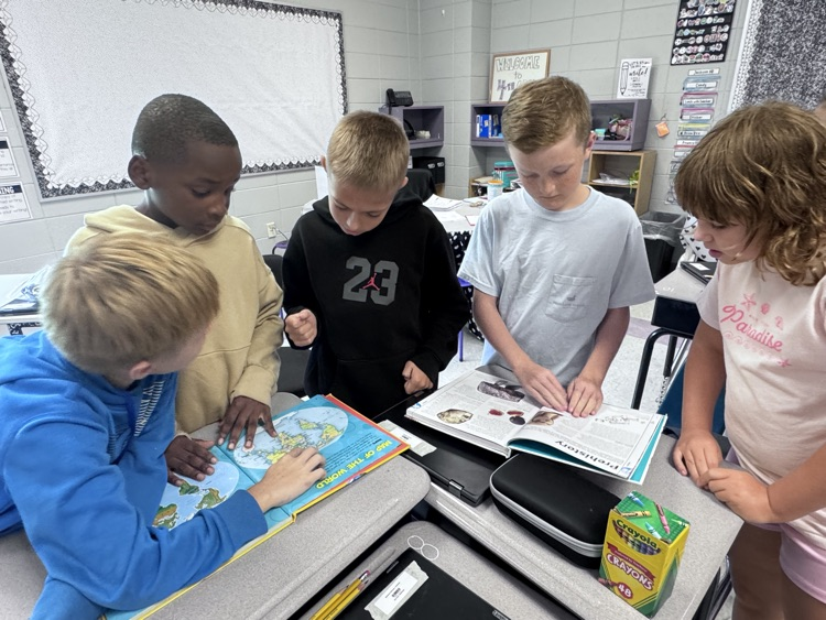 students reading maps