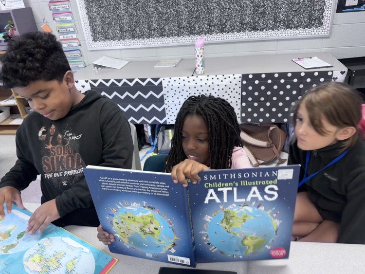 students reading maps