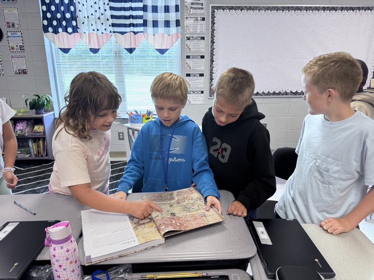 students reading maps