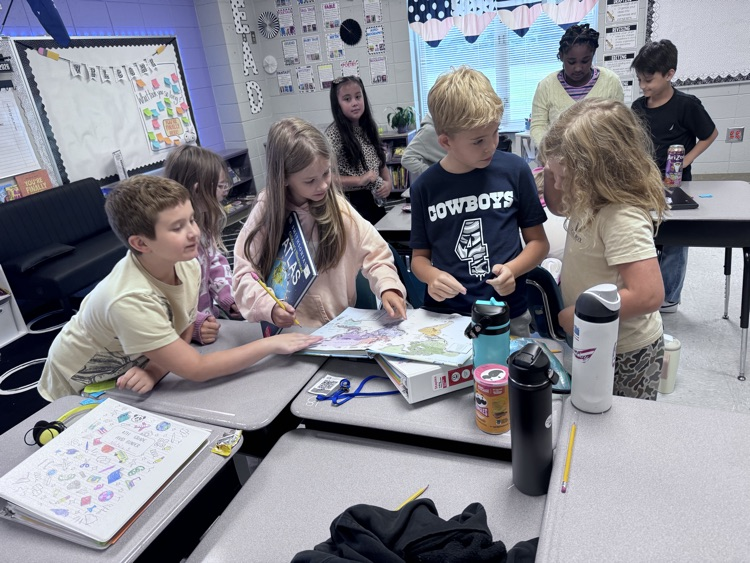 students reading maps