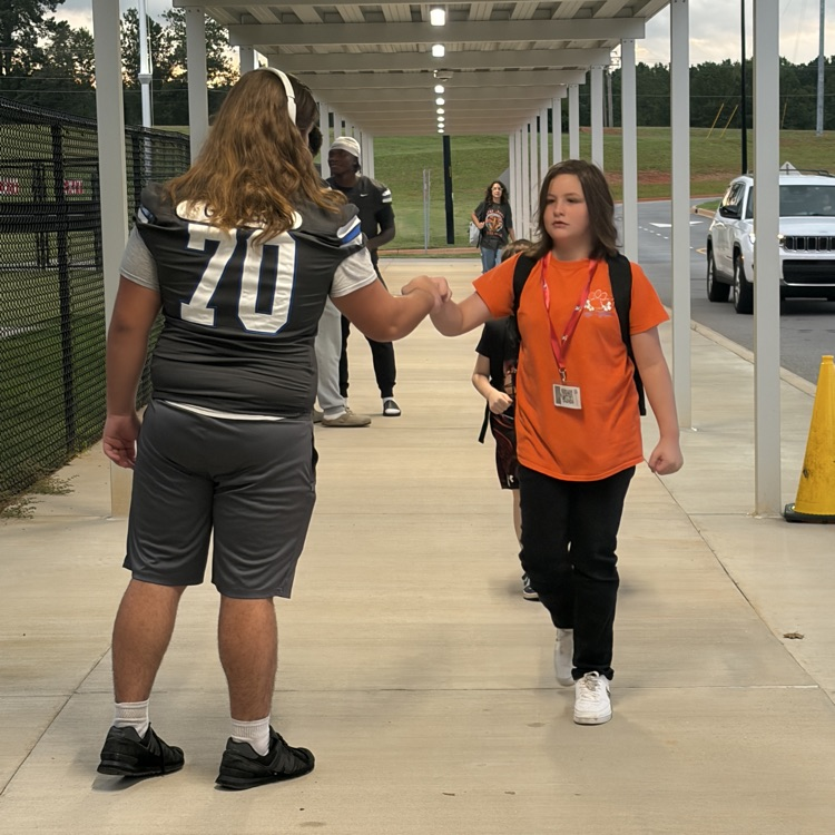 football players on car duty 