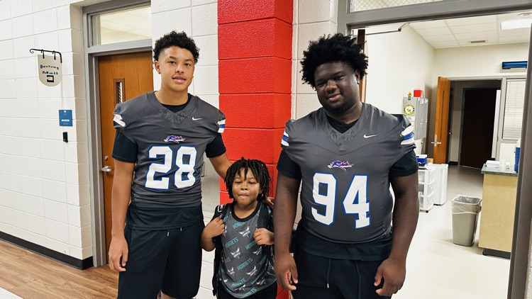 football players with student