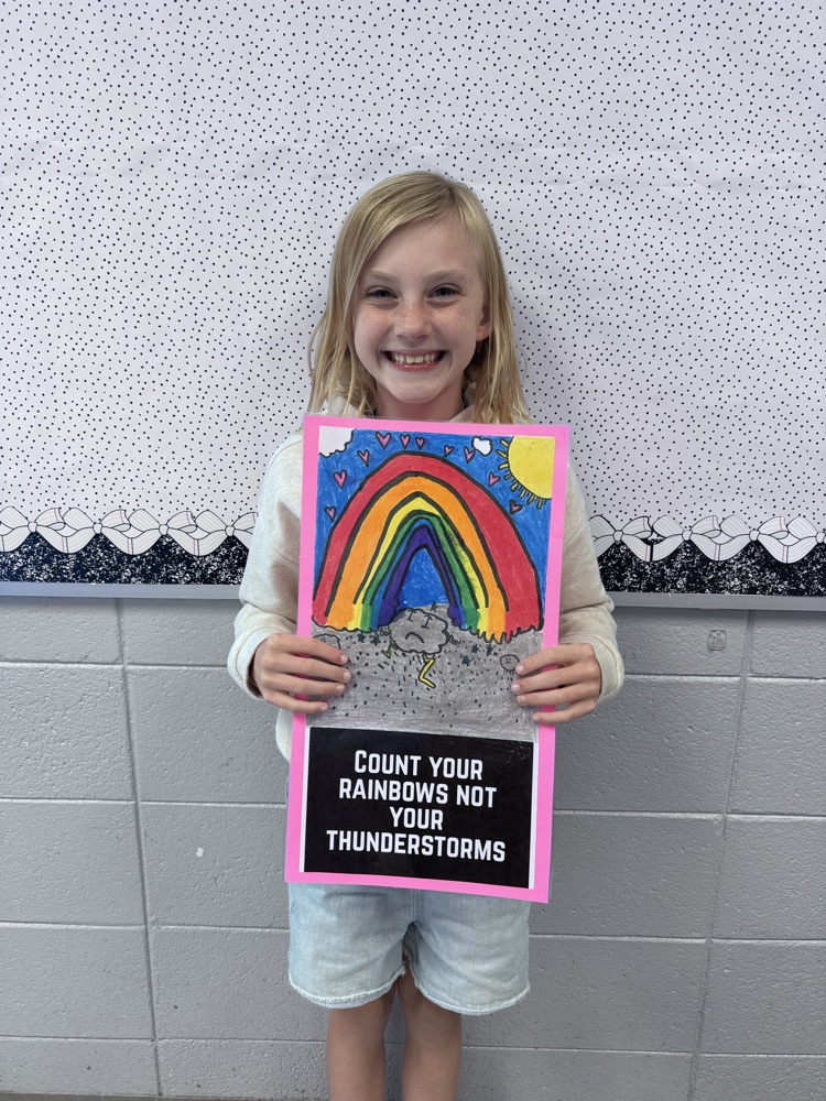student sharing artwork and quote