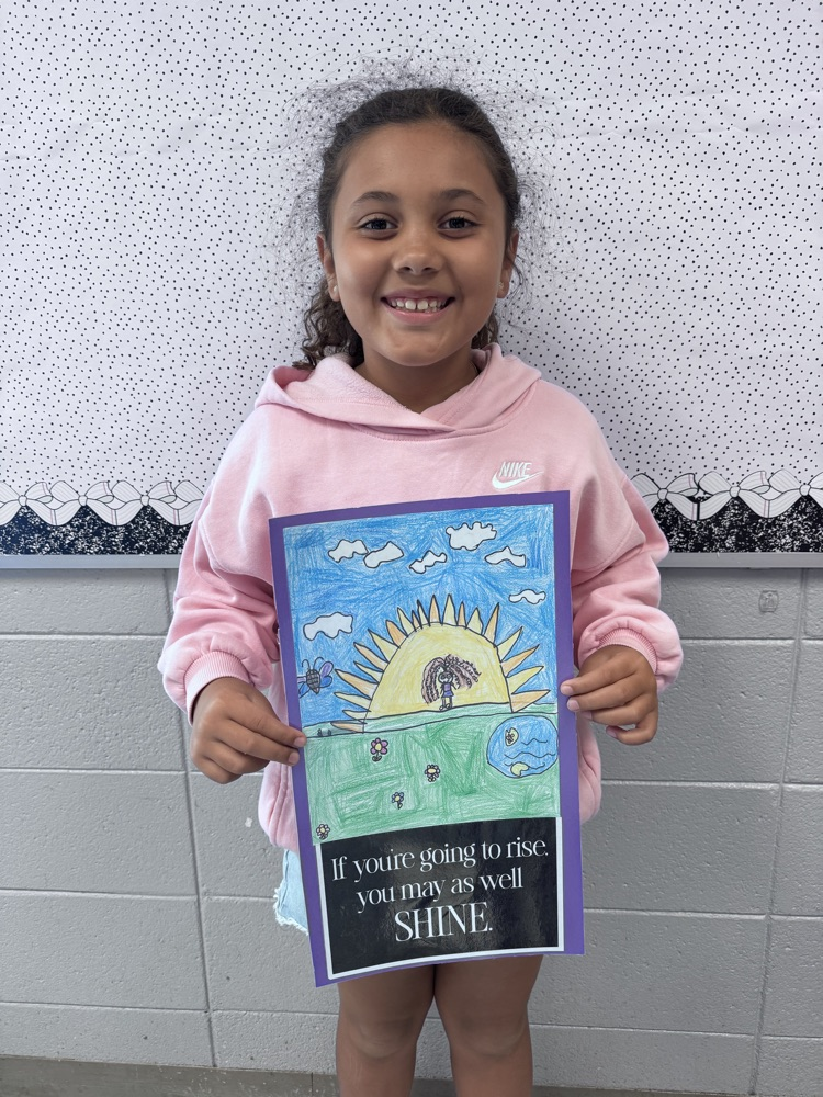 student sharing artwork and quote