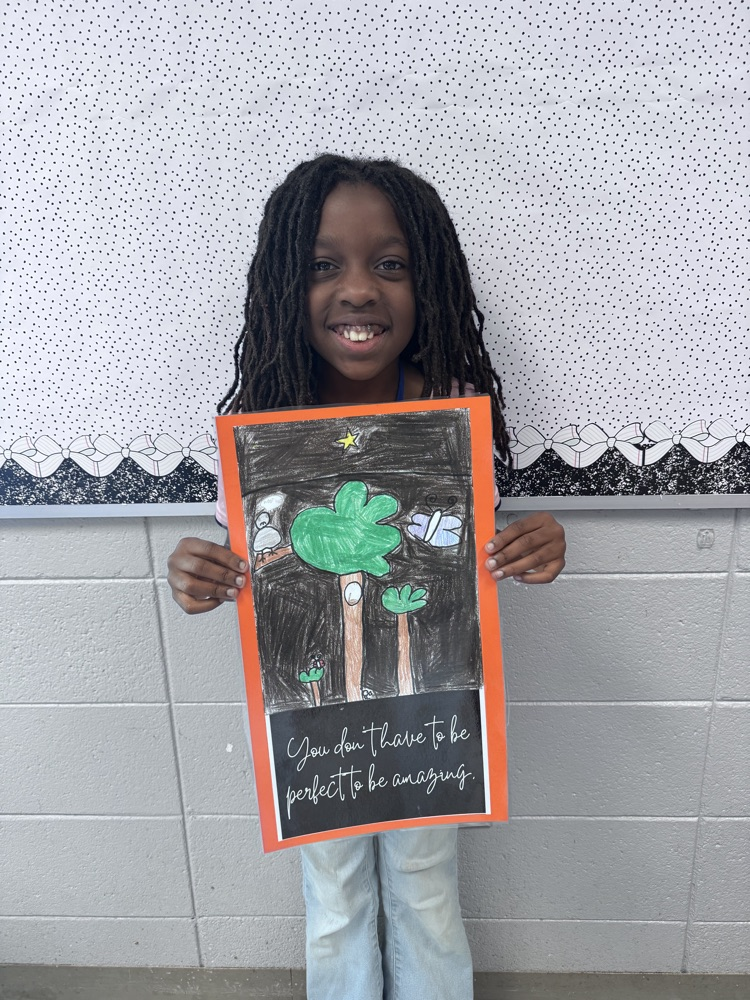 student sharing artwork and quote