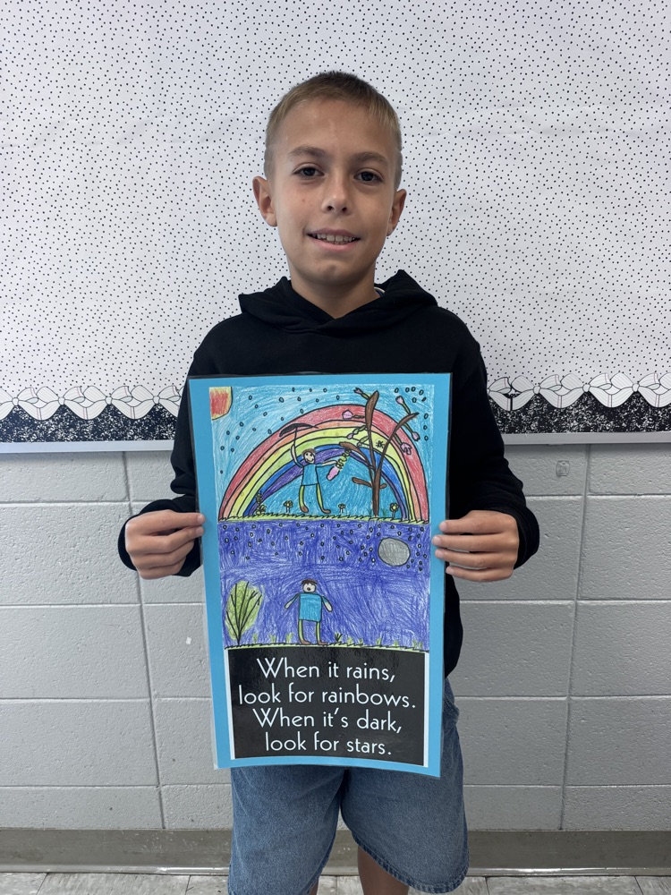 student sharing artwork and quote
