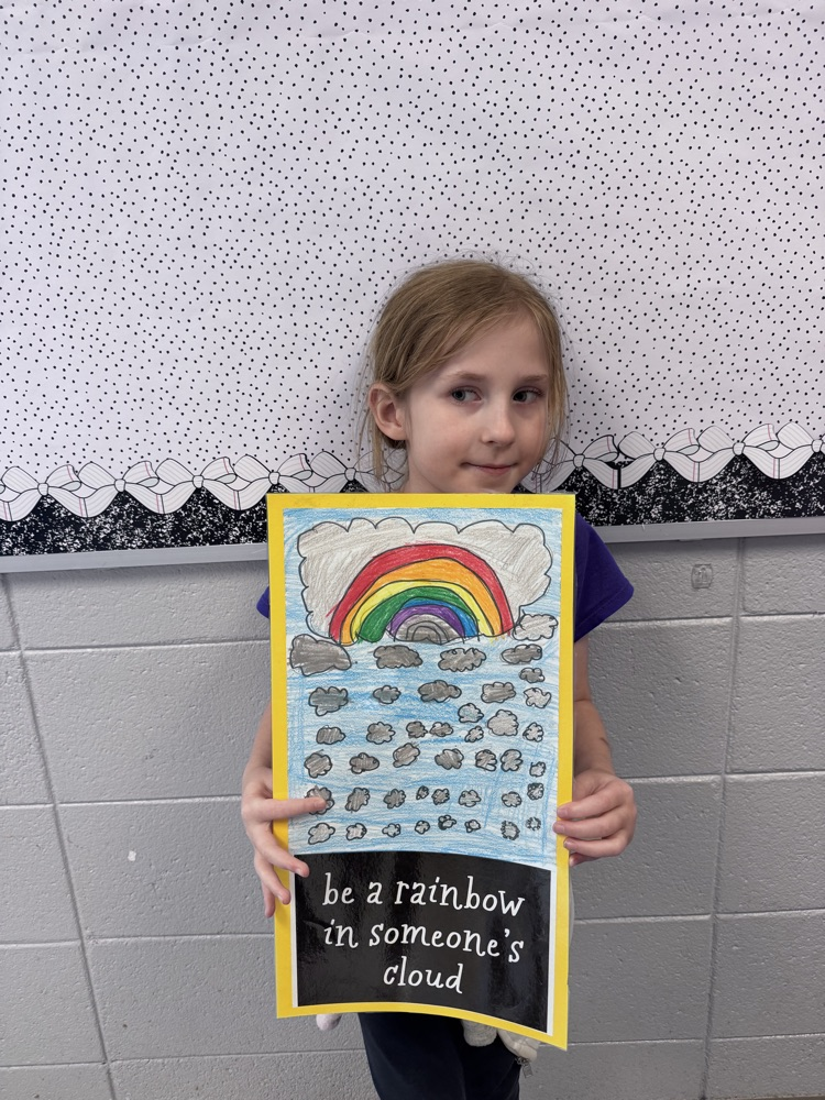 student sharing artwork and quote