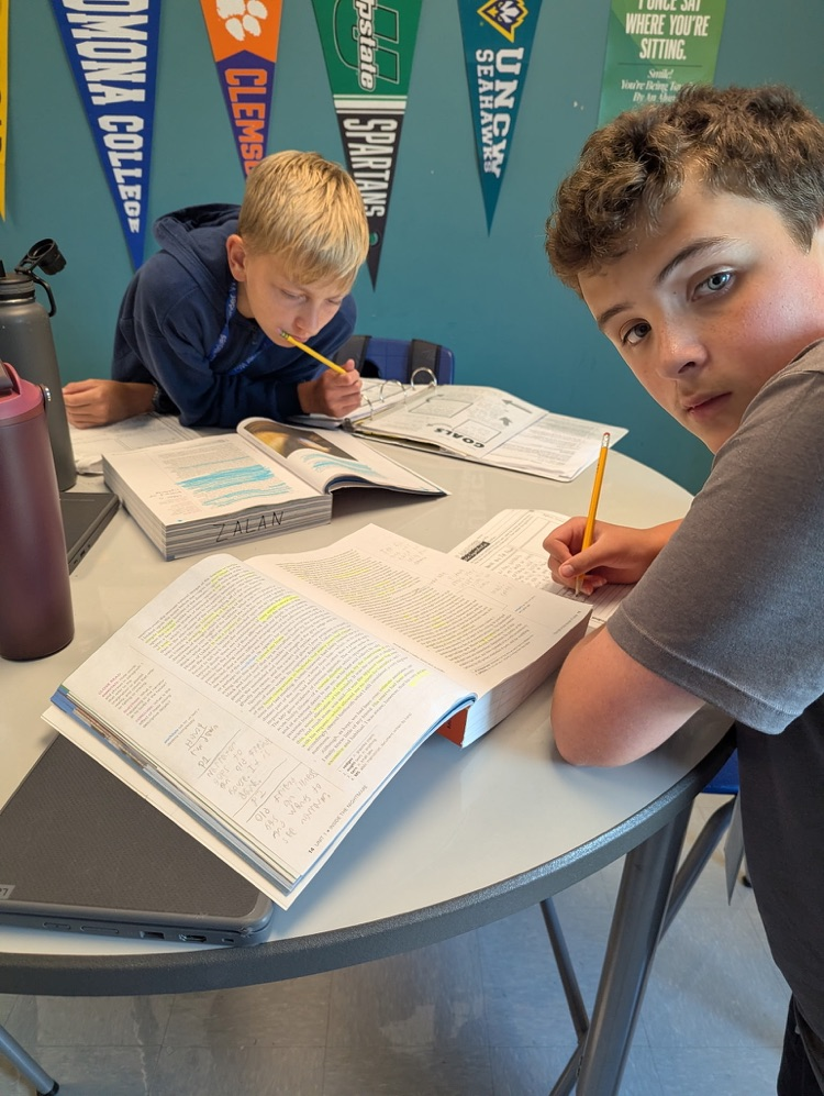kids reading and annotating text
