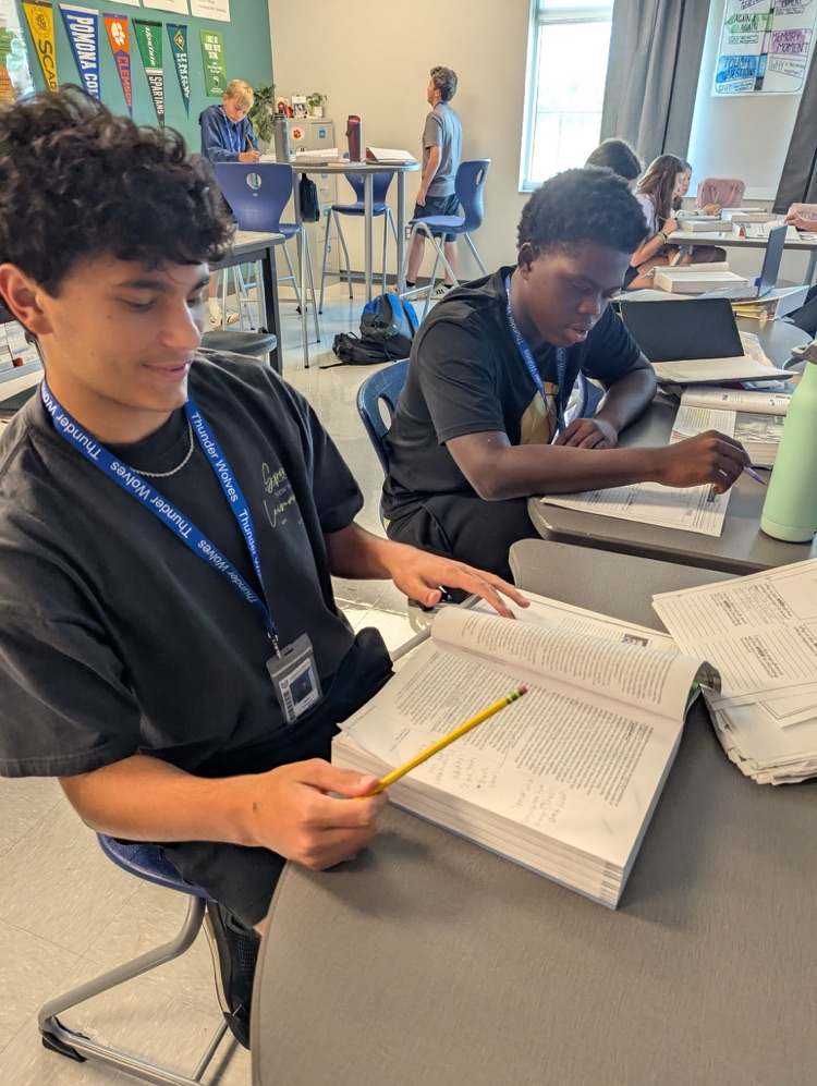 kids reading and annotating text
