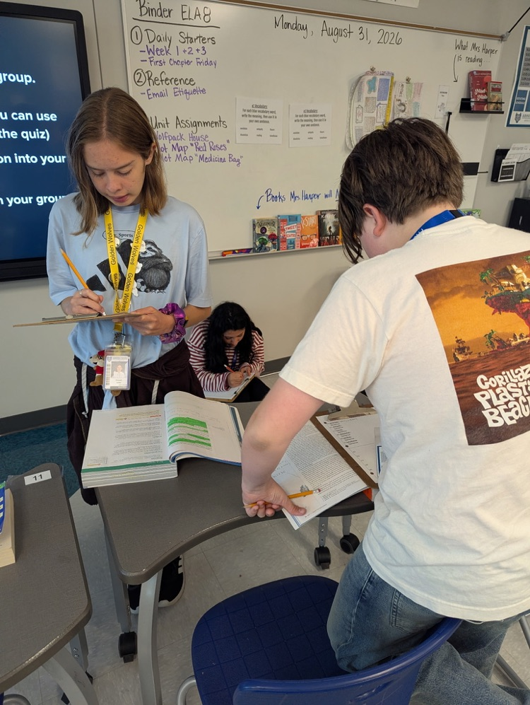 kids reading and annotating text