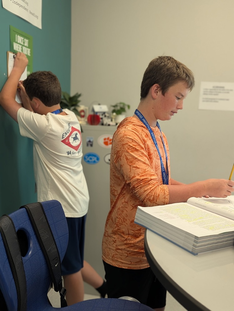 kids reading and annotating text