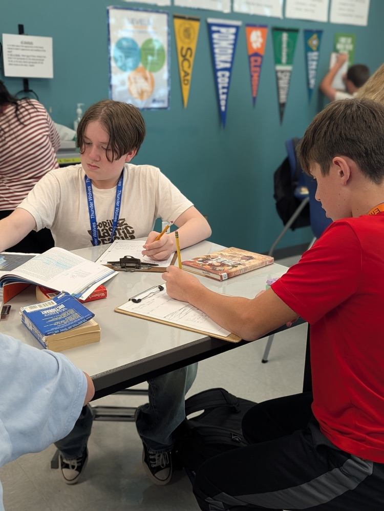 kids reading and annotating text