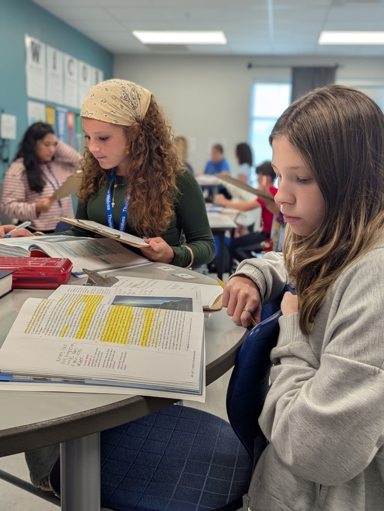 kids reading and annotating text
