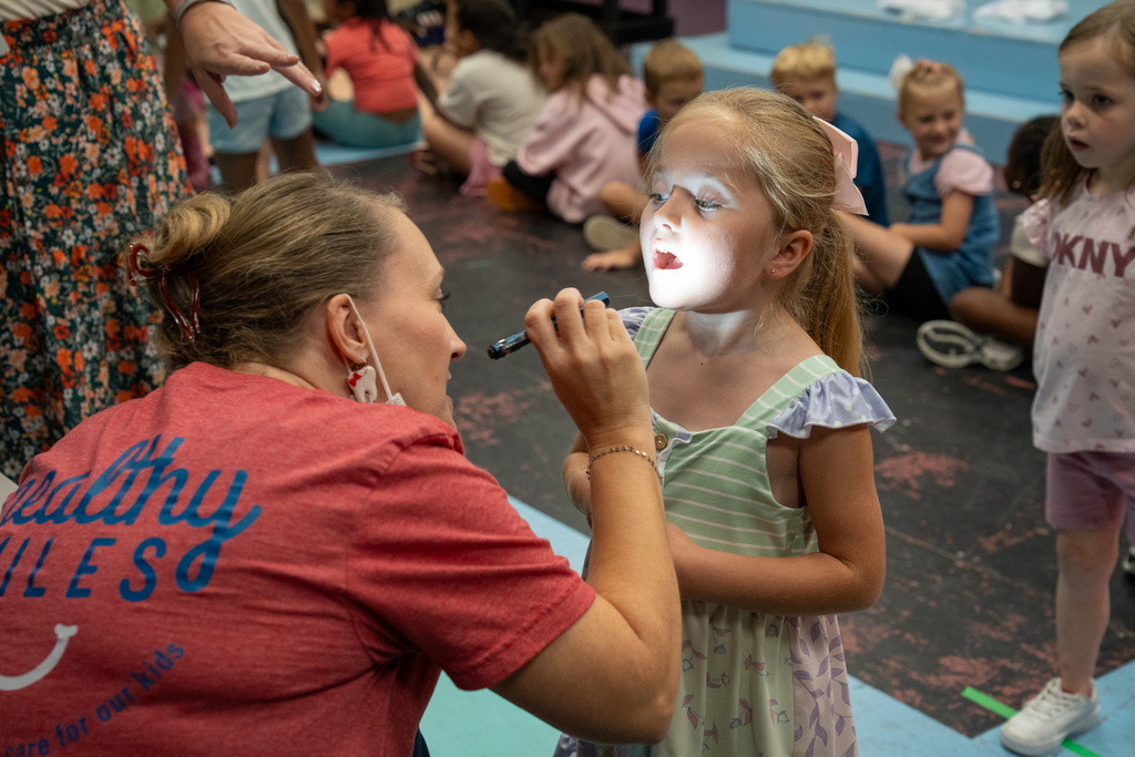 dentist checking student's teeth