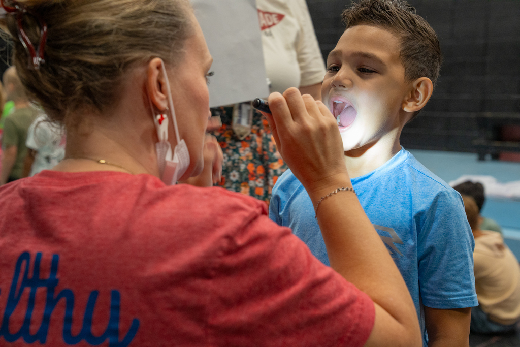 dentist checking student's teeth