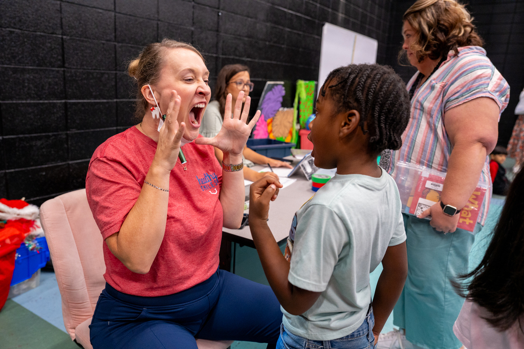 dentist checking student's teeth