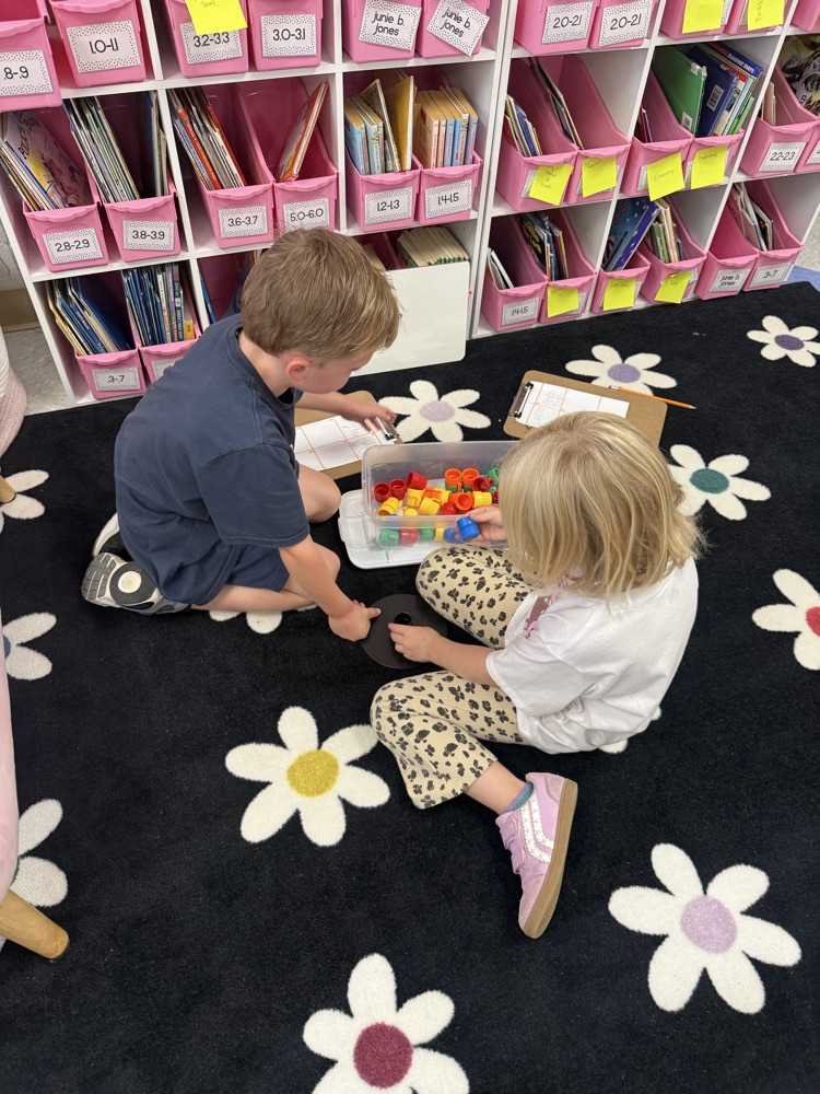 students working in their math stations to learn numbers
