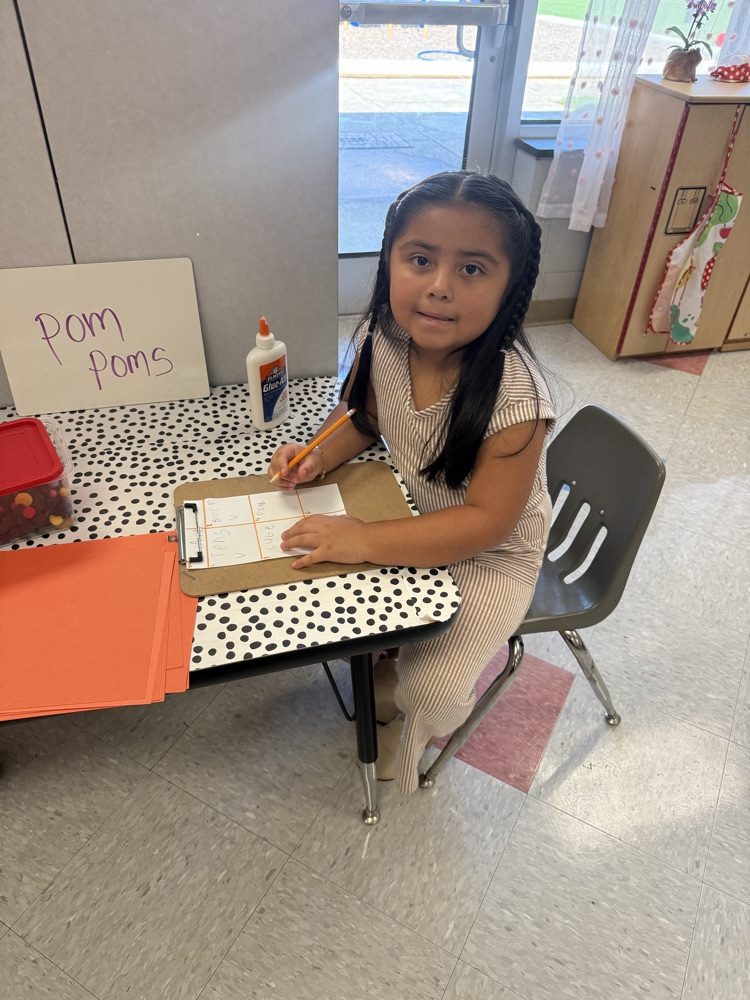 students working in their math stations to learn numbers