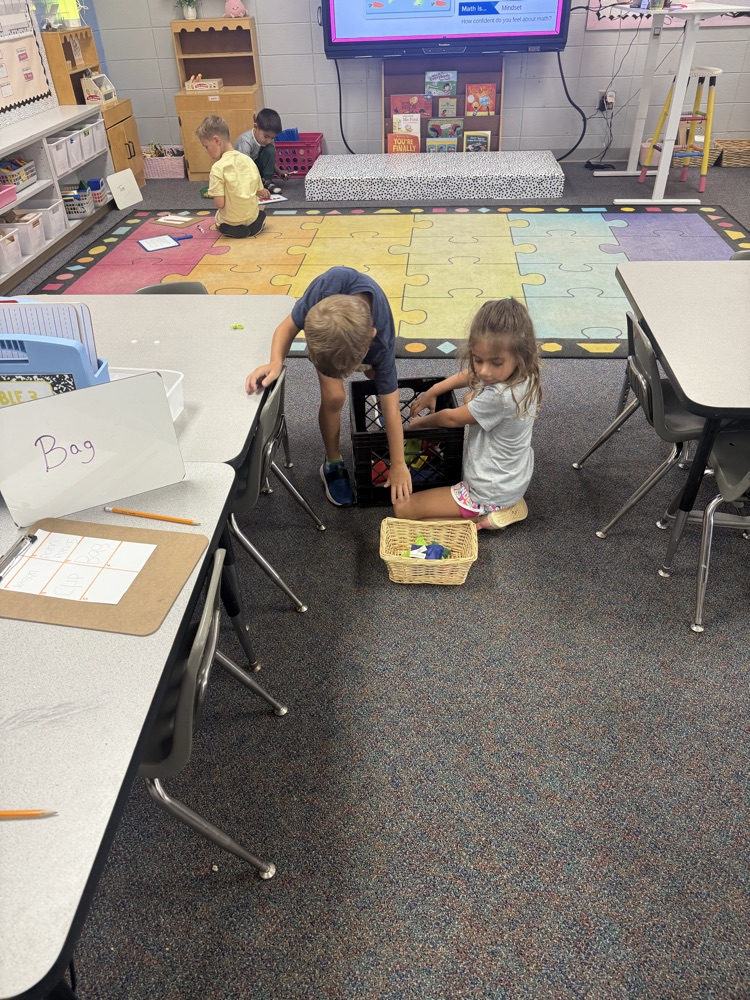 students working in their math stations to learn numbers