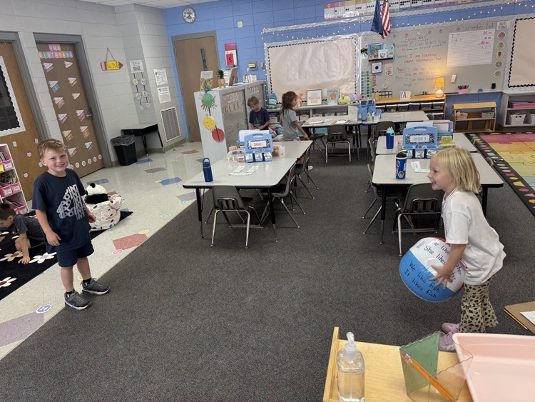 students working in their math stations to learn numbers