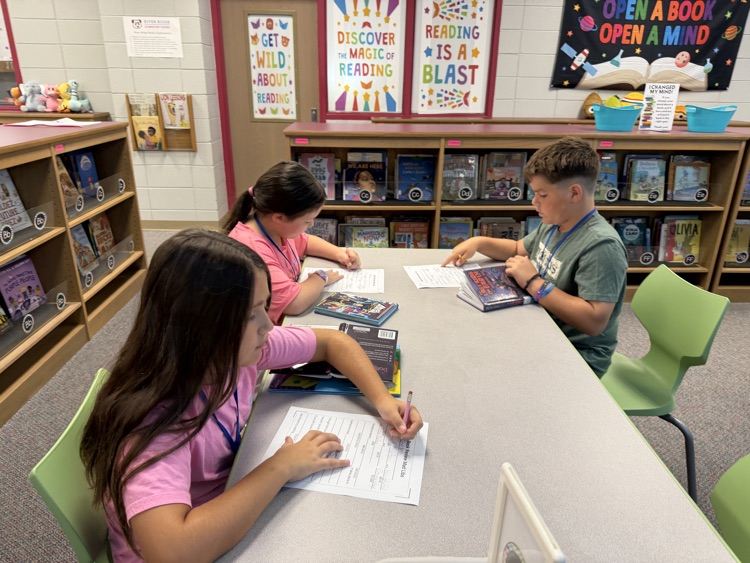 students writing at tables