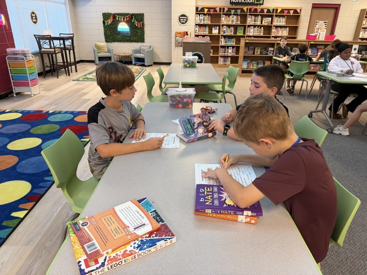 students writing at tables