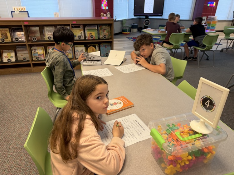 students writing at tables