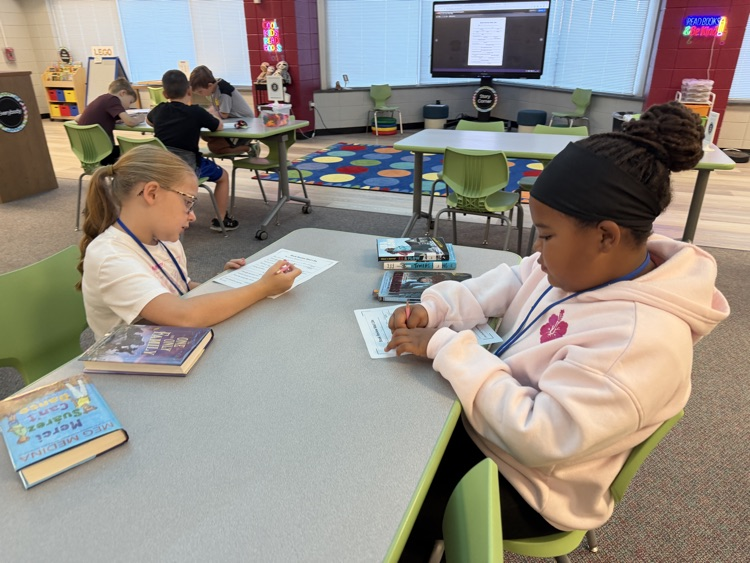 students writing at tables