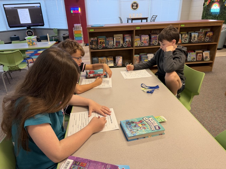 students writing at tables