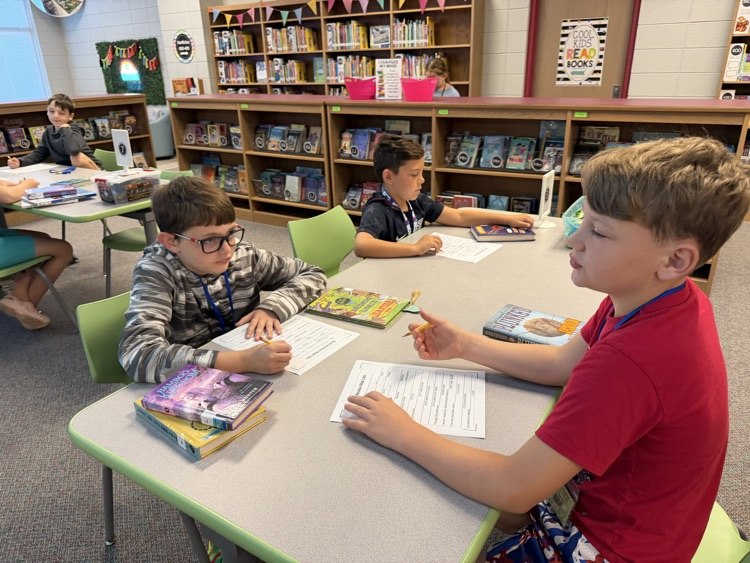 students writing at tables