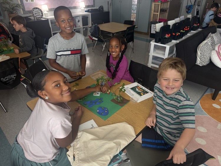 students working in classroom in groups 