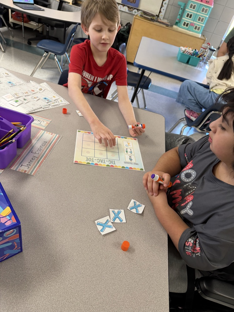 students playing tic tac toe