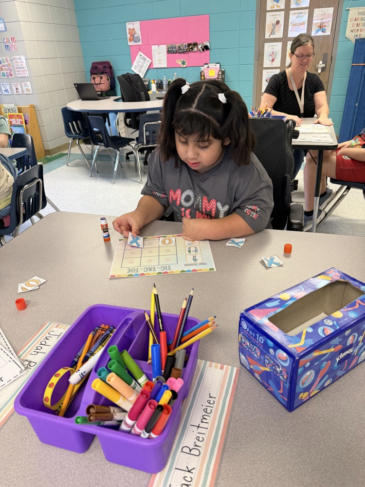 students playing tic tac toe