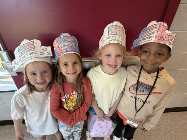 students smiling in the hallway