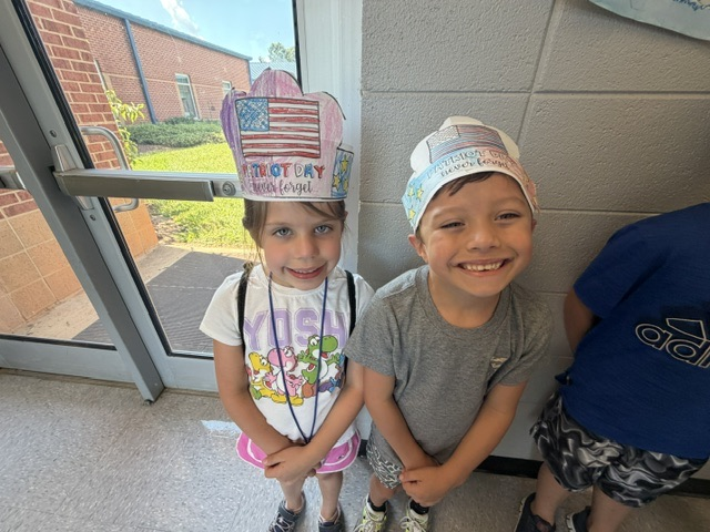students smiling in the hallway