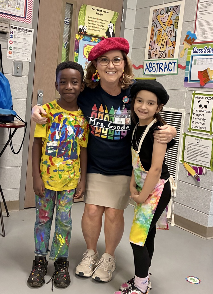 students and teacher dressed like artists