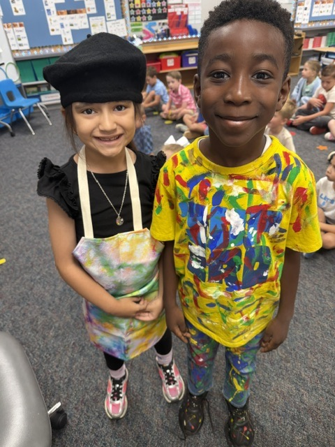 students and teacher dressed like artists
