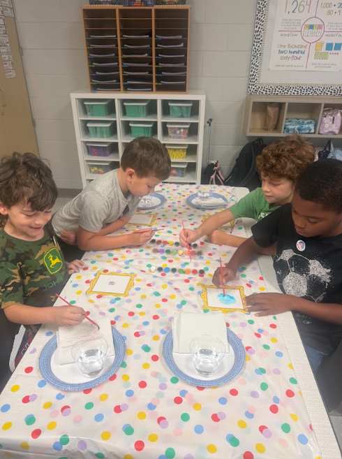 This image shows students participating in activities for Dot Day.