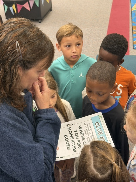 students finding and reading clues