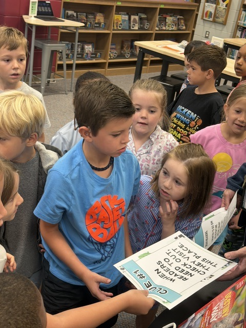 students finding and reading clues