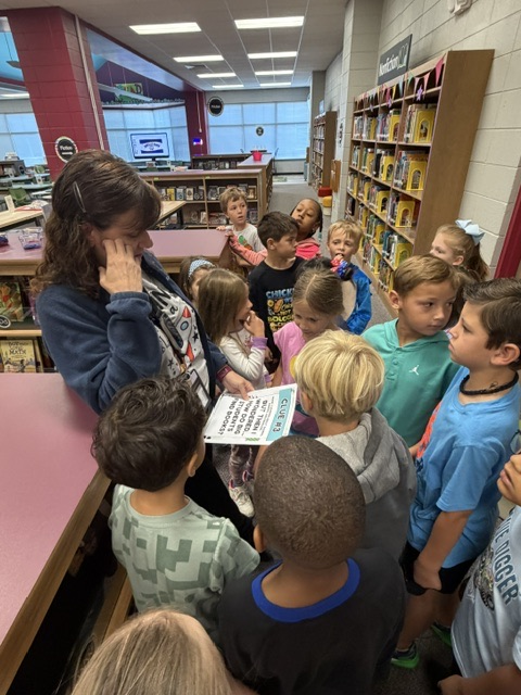 students finding and reading clues